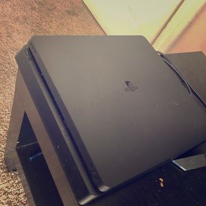 PS4 with controllers and games